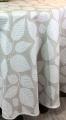 Nappe Sindoa, feuilles allover, fond beige, ronde, polycoton Jacquard 